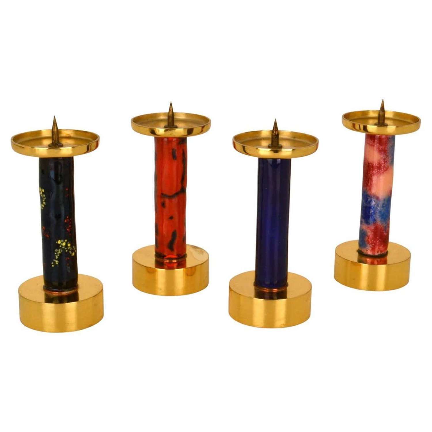 Four Enameled and Gilded Brass Candle Sticks